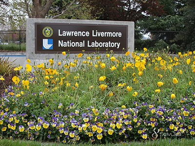 photo of entry sign surrounded by flowers